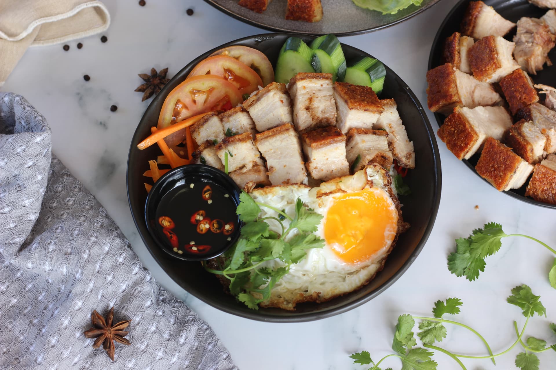 Crispy roast pork rice plate with fried egg